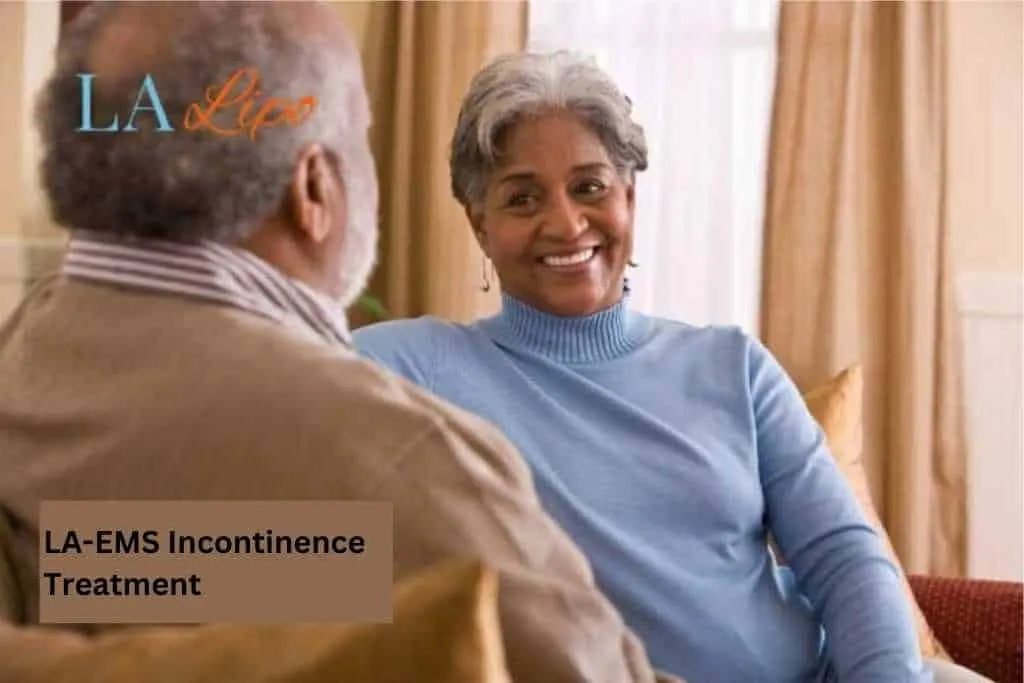Couple sat smiling at each other - LA-EMS treatment Tring