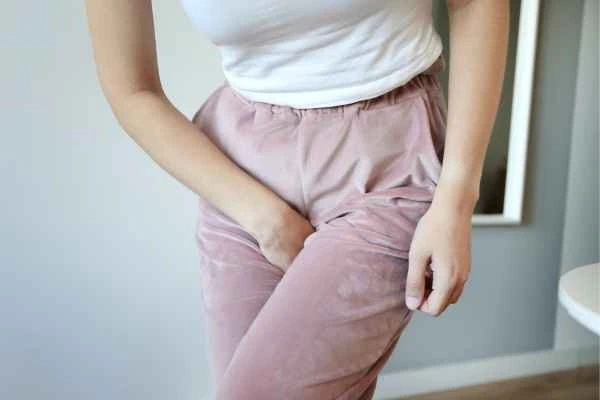 older woman running to the toilet because of urinary incontinence Tring