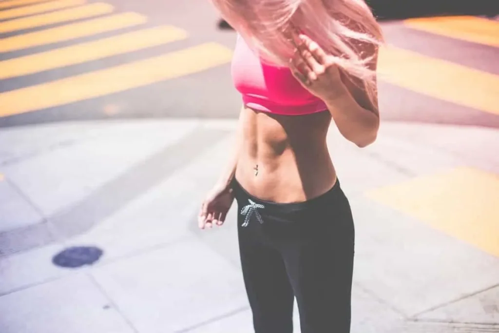 Woman with toned stomach after LA-EMS Body Sculpting Treatment Tring 